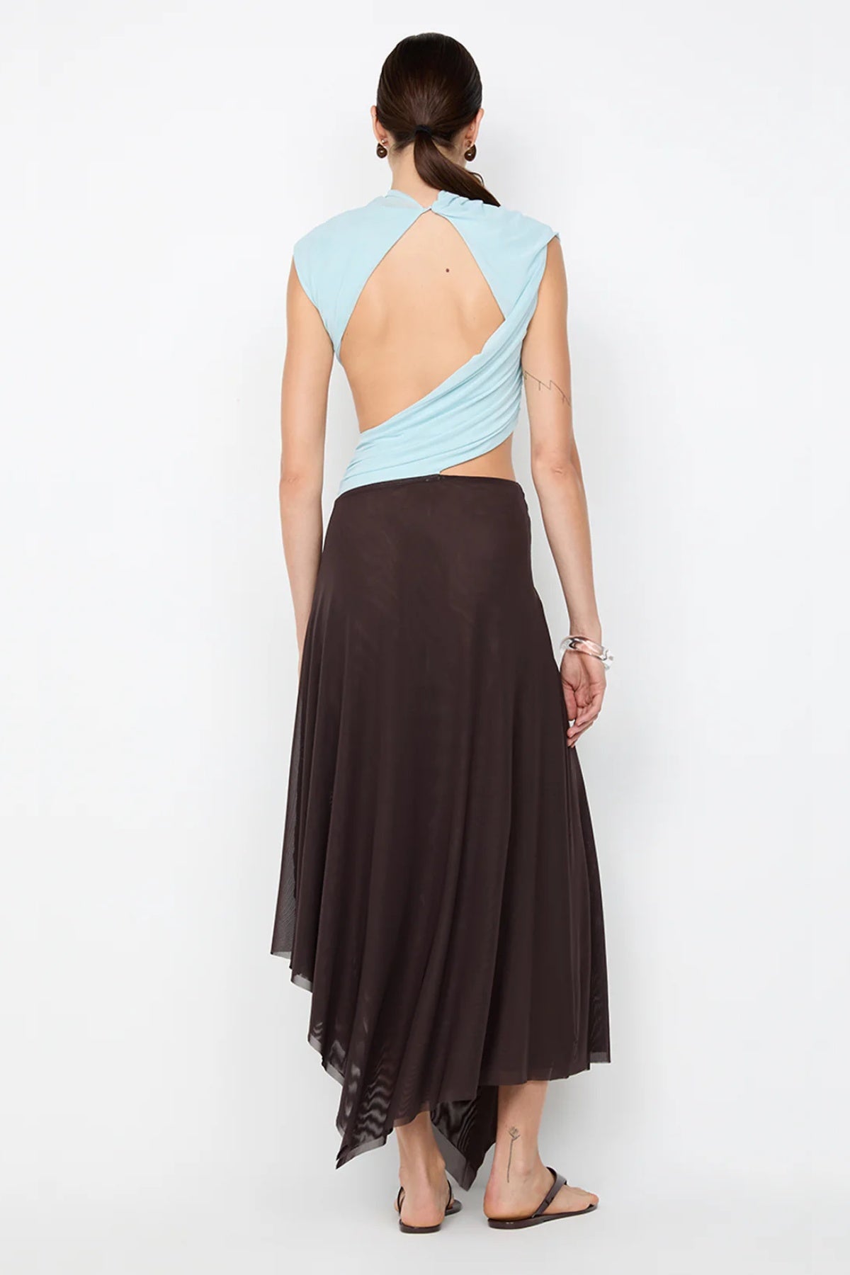 Conni Asym Midi Dress by Bec + Bridge, a two-tone mesh silhouette with cut-out waist, gathered sash, and raw hem for sculptural evening allure.