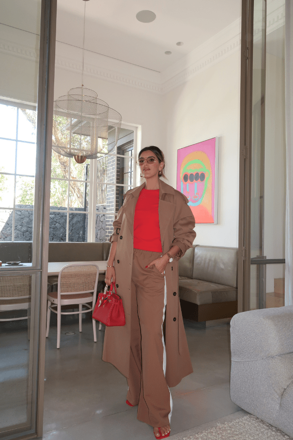 Denver Pant Tan by Sneaky Link, relaxed fit with elastic waist, contrast side stripe, and drawstring for a sporty look. Made from polyester blend. Cold hand wash. Size down if between sizes.