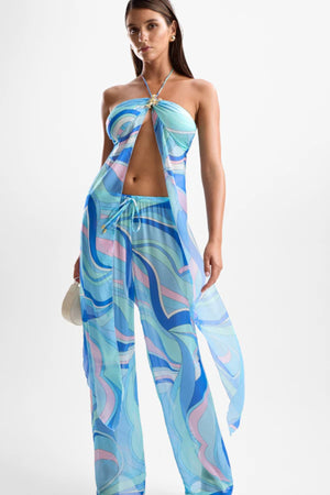 ‘Coral’ Lobster Drape Top Dolce Blue by Cin Cin – halter-neck top in cool blue and pastel swirl print with gold clasp detailing.
