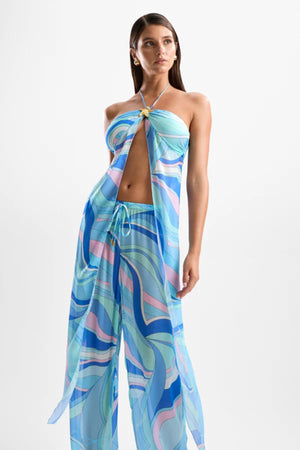 ‘Coral’ Lobster Drape Top Dolce Blue by Cin Cin – halter-neck top in cool blue and pastel swirl print with gold clasp detailing.
