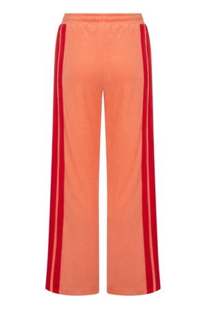 Corfu Terry Pant in Bougainvillea Pink by Araminta James, relaxed wide-leg cotton terry pants with contrasting red velour side panels, elasticated waistband, and side pockets for effortless coastal styling.
