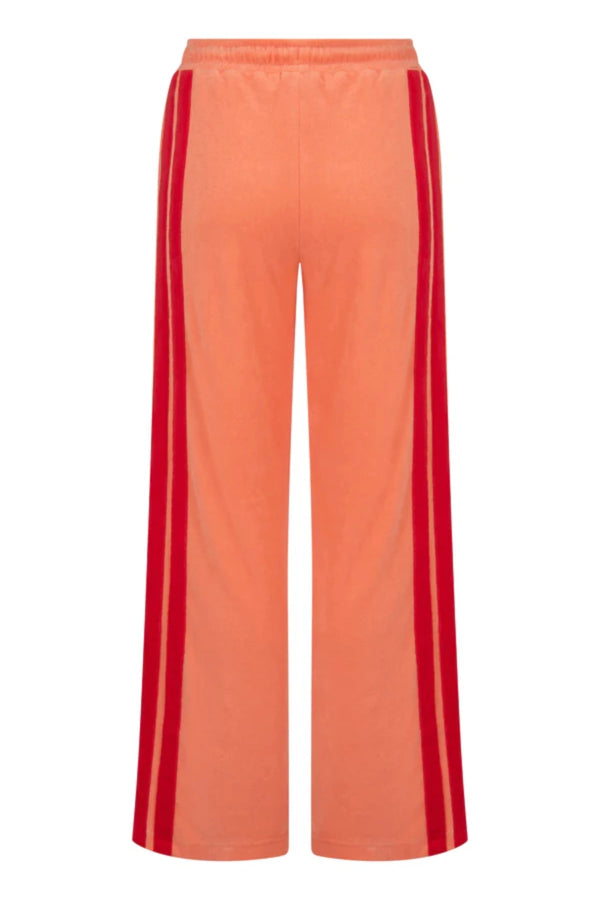 Corfu Terry Pant in Bougainvillea Pink by Araminta James, relaxed wide-leg cotton terry pants with contrasting red velour side panels, elasticated waistband, and side pockets for effortless coastal styling.