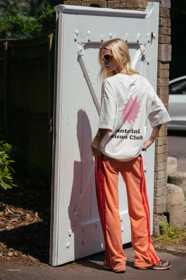 Corfu Terry Pant in Bougainvillea Pink by Araminta James, relaxed wide-leg cotton terry pants with contrasting red velour side panels, elasticated waistband, and side pockets for effortless coastal styling.