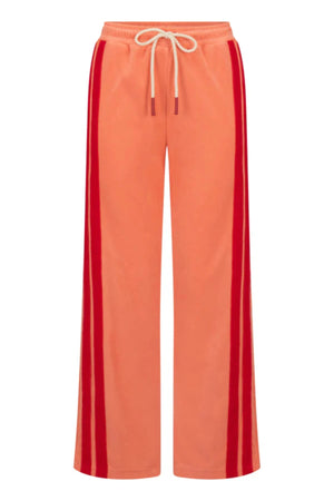 Corfu Terry Pant in Bougainvillea Pink by Araminta James, relaxed wide-leg cotton terry pants with contrasting red velour side panels, elasticated waistband, and side pockets for effortless coastal styling.