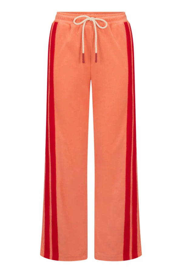 Corfu Terry Pant in Bougainvillea Pink by Araminta James, relaxed wide-leg cotton terry pants with contrasting red velour side panels, elasticated waistband, and side pockets for effortless coastal styling.