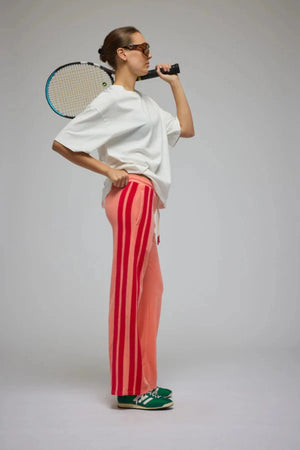 Corfu Terry Pant in Bougainvillea Pink by Araminta James, relaxed wide-leg cotton terry pants with contrasting red velour side panels, elasticated waistband, and side pockets for effortless coastal styling.