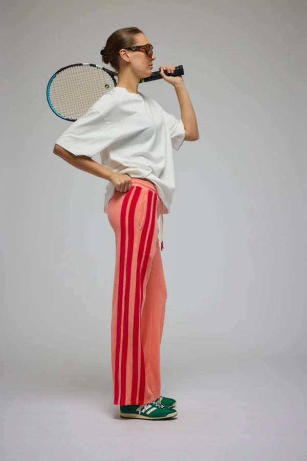 Corfu Terry Pant in Bougainvillea Pink by Araminta James, relaxed wide-leg cotton terry pants with contrasting red velour side panels, elasticated waistband, and side pockets for effortless coastal styling.