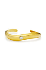 Corniglia Bracelet Gold by Amber Sceats, gold-plated cuff with cubic zirconia crystal detail, a trendy piece perfect for chic events or everyday elegance.