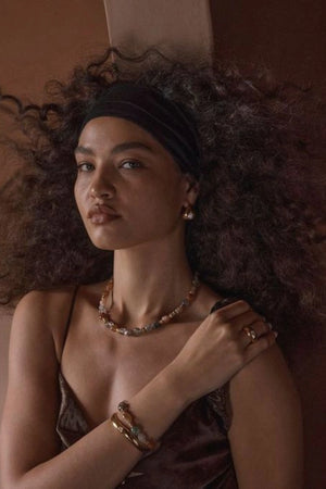 Corniglia Bracelet Gold by Amber Sceats, gold-plated cuff with cubic zirconia crystal detail, a trendy piece perfect for chic events or everyday elegance.