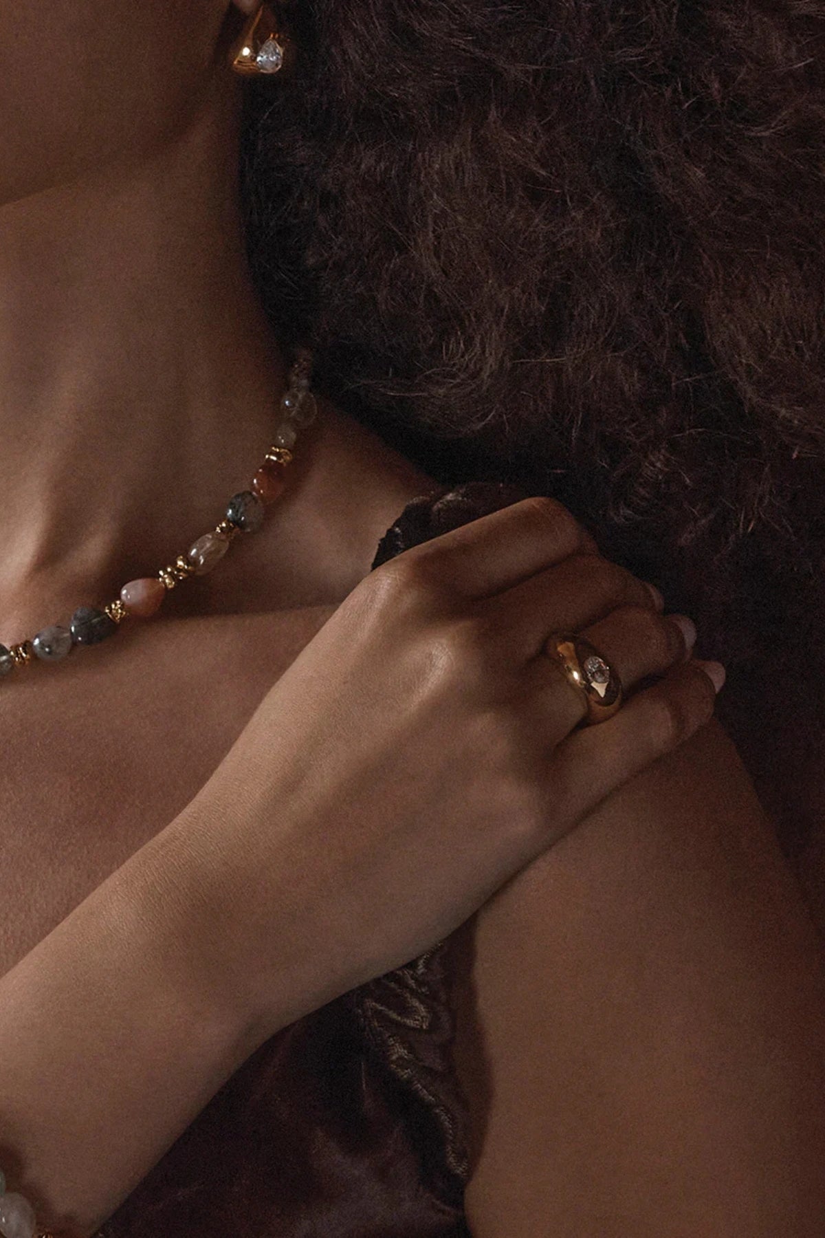 Corniglia Ring Gold by Amber Sceats, sculptural curved band with cubic zirconia crystal, a trendy piece perfect for everyday elegance or chic sets.