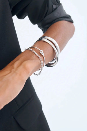 Cristabel Bangle by Avant Studio, an elegant 925 sterling silver oval bangle with minimalist 5mm band. Ideal for daily wear.