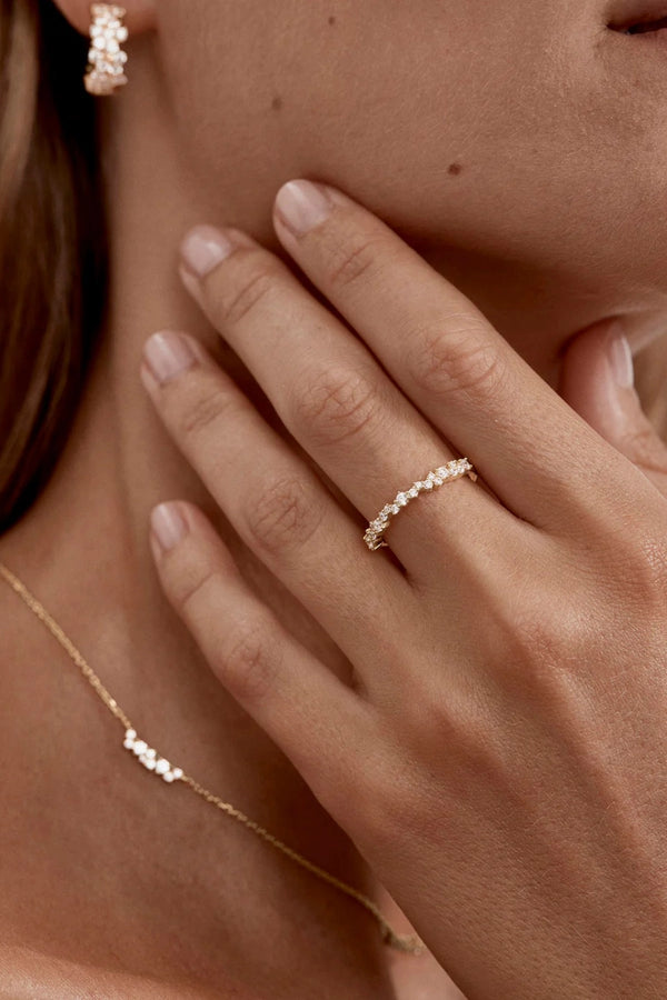 Crystal Dust Fine Ring by By Charlotte – 18k gold vermeil stacking ring with undulating band and sparkling cubic zirconias.