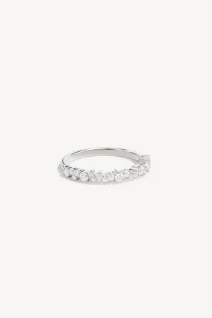 Crystal Dust Fine Ring by By Charlotte – sterling silver stacking ring with undulating band and sparkling cubic zirconias.