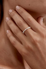 Crystal Dust Fine Ring by By Charlotte – sterling silver stacking ring with undulating band and sparkling cubic zirconias.