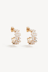 Crystal Dust Hoops by By Charlotte – 18k gold plated hoop earrings with scattered cubic zirconia stones.