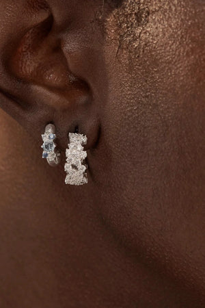 Crystal Dust Hoops by By Charlotte – 18k gold plated hoop earrings with scattered cubic zirconia stones.