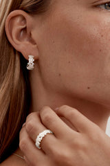 Crystal Dust Hoops by By Charlotte – 18k gold plated hoop earrings with scattered cubic zirconia stones.