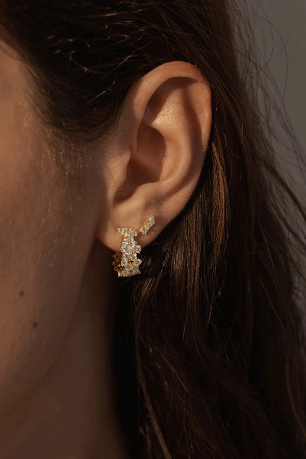 Crystal Dust Hoops by By Charlotte – 18k gold plated hoop earrings with scattered cubic zirconia stones.