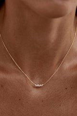 Crystal Dust Necklace by By Charlotte – 18k gold vermeil butterfly wing pendant with cubic zirconia stones.