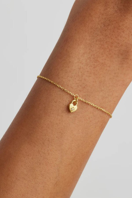 Crystal Lotus Heart Padlock Bracelet by Fine Collection, features a gold vermeil padlock with lotus motif. Perfect for gifting or layering.
