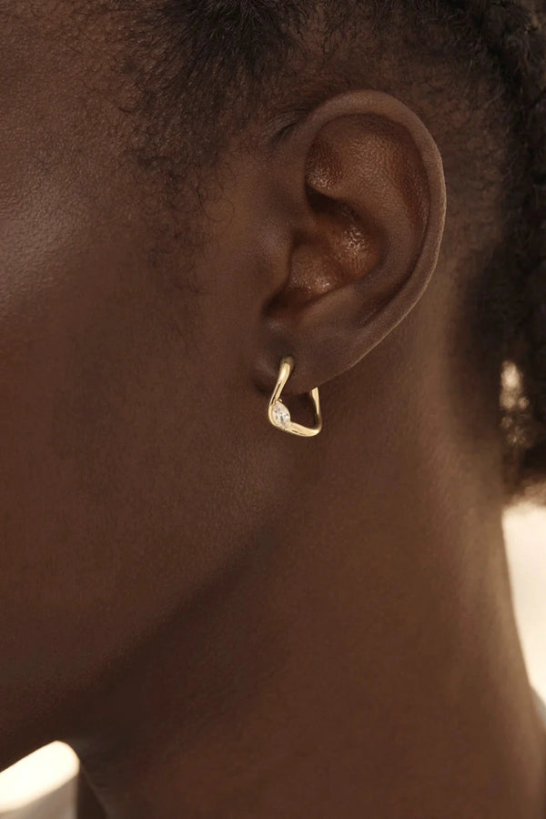 Crystal Wings Hoops by By Charlotte – 18k gold vermeil hoop earrings with marquise cubic zirconia stones.