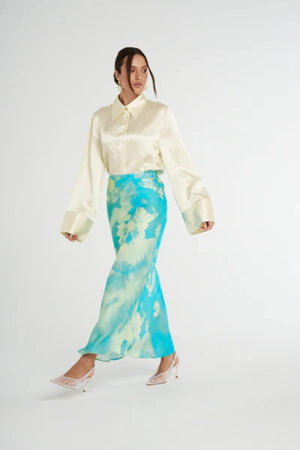 Cuff Shirt Butter by Summi Summi, soft butter-hued shirt with a structured collar and oversized flared cuffs. Lightweight acetate fabric for effortless sophistication.