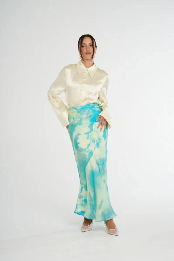 Cuff Shirt Butter by Summi Summi, soft butter-hued shirt with a structured collar and oversized flared cuffs. Lightweight acetate fabric for effortless sophistication.