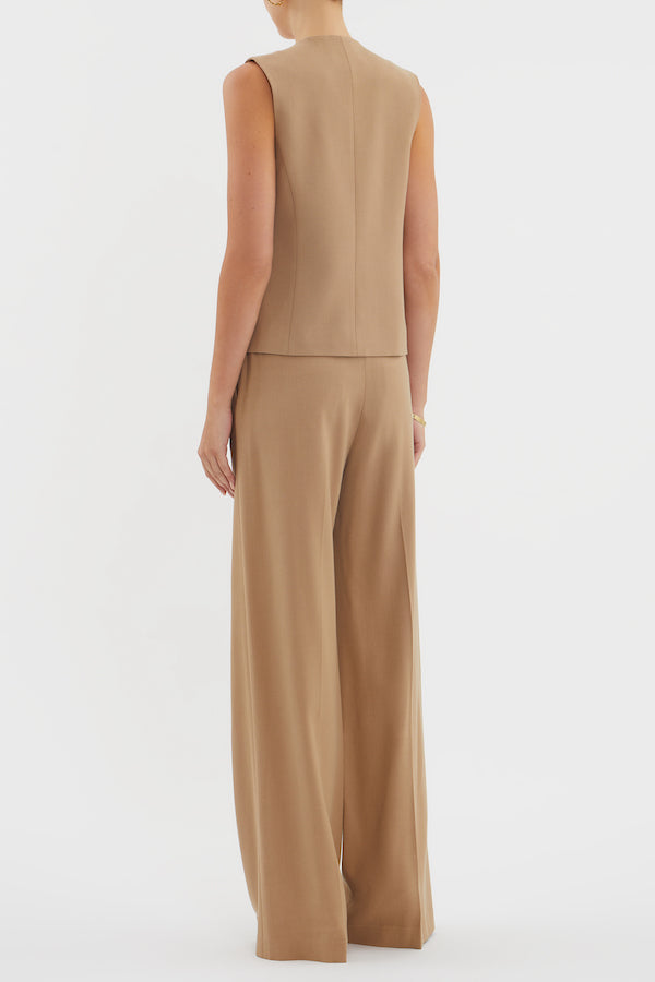 Devin Vest Tan by Rebecca Vallance – Tailored boxy vest with V neckline, shell buttons, and jet pockets. Fully lined for comfort. Fits true to size.