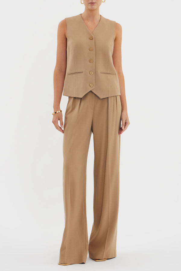 Devin Vest Tan by Rebecca Vallance – Tailored boxy vest with V neckline, shell buttons, and jet pockets. Fully lined for comfort. Fits true to size.