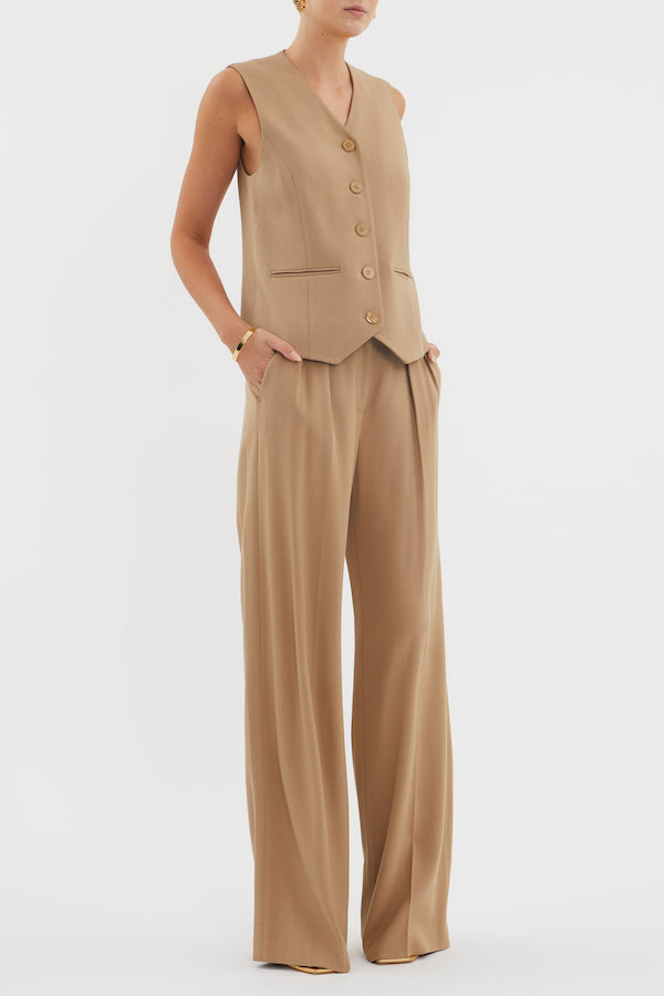 Devin Vest Tan by Rebecca Vallance – Tailored boxy vest with V neckline, shell buttons, and jet pockets. Fully lined for comfort. Fits true to size.