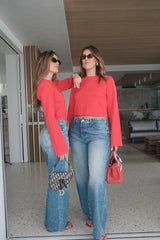 The Dodger Button Sneak Wipeout by MOTHER, trendy mid-blue jeans with a slouchy fit, loose straight leg, and a clean hem. Perfect for a relaxed look with whiskering and knee fading, made from rigid SUPERIOR denim.