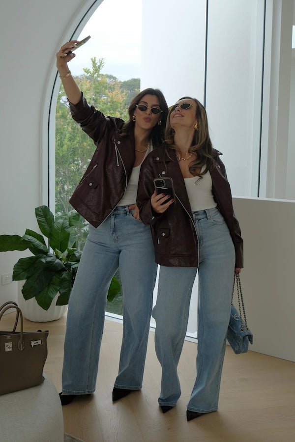 Sia Biker Jacket Burgundy by Sneaky Link — A modern classic in deep burgundy faux leather with croc texture. Oversized fit with signature biker details. Dry clean only.