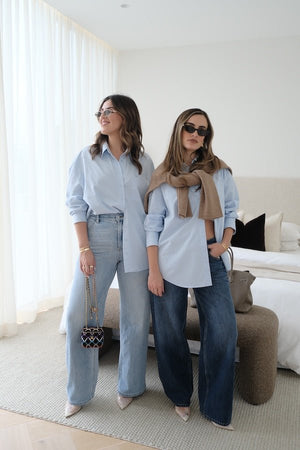 Boston Shirt Light Blue by Sneaky Link — Timeless oversized button-up in crisp cotton poplin with signature snake embroidery on the pocket. Classic, fresh, and versatile.