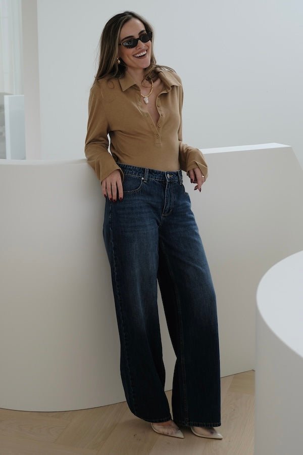 Elisha Baggy Jean Indigo by Sneaky Link, relaxed mid-rise baggy jeans in 100% cotton with branded details. Runs big; size down if unsure.