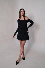 Sneaky Mini Skirt Black by Sneaky Link – A-line high-waisted mini with boned waist and flap pockets, perfect for day-to-night styling.