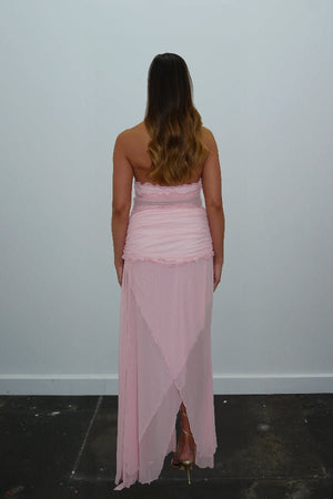 Bianca Set Candy Pink by DŽO — A flirty two-piece with a ruched halter crop top and layered sheer mesh skirt. Delicate ruffles add texture; wear together or separately for versatile looks.