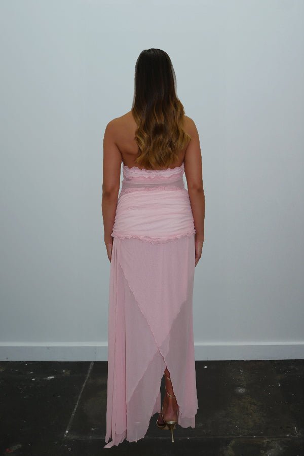 Bianca Set Candy Pink by DŽO — A flirty two-piece with a ruched halter crop top and layered sheer mesh skirt. Delicate ruffles add texture; wear together or separately for versatile looks.