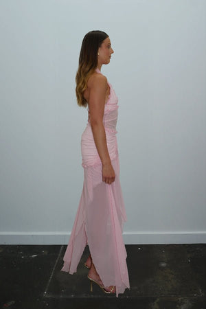 Bianca Set Candy Pink by DŽO — A flirty two-piece with a ruched halter crop top and layered sheer mesh skirt. Delicate ruffles add texture; wear together or separately for versatile looks.