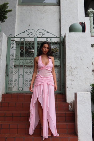 Bianca Set Candy Pink by DŽO — A flirty two-piece with a ruched halter crop top and layered sheer mesh skirt. Delicate ruffles add texture; wear together or separately for versatile looks.