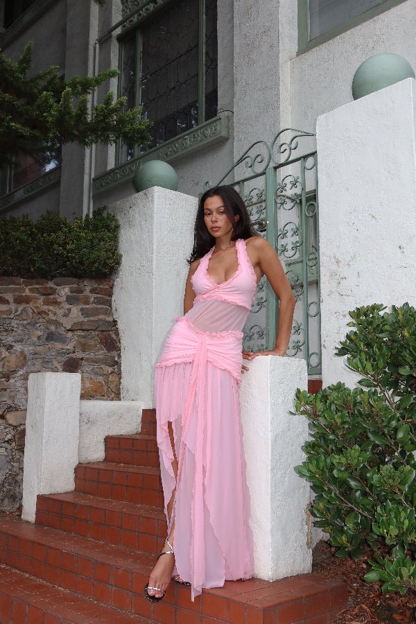 Bianca Set Candy Pink by DŽO — A flirty two-piece with a ruched halter crop top and layered sheer mesh skirt. Delicate ruffles add texture; wear together or separately for versatile looks.