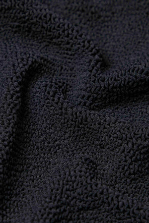 Dallas Swim Black by Hunza G – a sculpting crinkle one-piece with square neckline and front zip. Perfect for bold poolside style.6