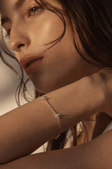 Dancing in the Wind Bracelet by By Charlotte – 18k gold vermeil bracelet with cubic zirconia butterfly pendants.