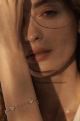 Dancing in the Wind Bracelet by By Charlotte – 18k gold vermeil bracelet with cubic zirconia butterfly pendants.