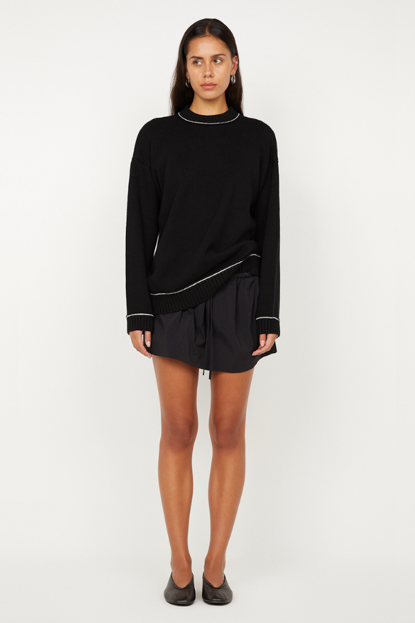 Dante Mini Skirt in Black by Bec + Bridge, a gathered stretch mini with drawstring waist. Perfect for relaxed everyday styling.