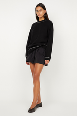 Dante Mini Skirt in Black by Bec + Bridge, a gathered stretch mini with drawstring waist. Perfect for relaxed everyday styling.