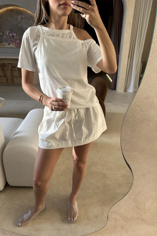 Dante Mini Skirt in Ivory by Bec + Bridge, stretch nylon mini with drawstring waist and gathered finish. Perfect for easy everyday styling.