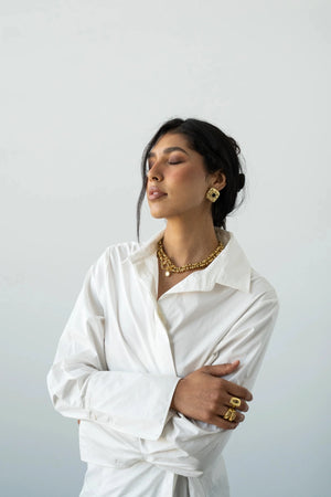 Daphne Earrings Gold by Mountain and Moon – hammered gold earrings with Black Onyx gemstone and sculptural silhouette.