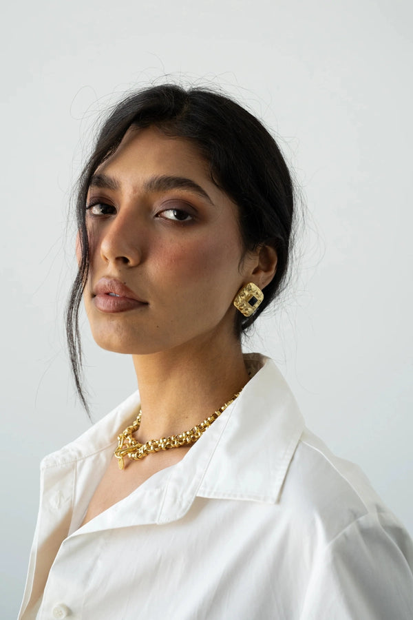 Daphne Earrings Gold by Mountain and Moon – hammered gold earrings with Black Onyx gemstone and sculptural silhouette.
