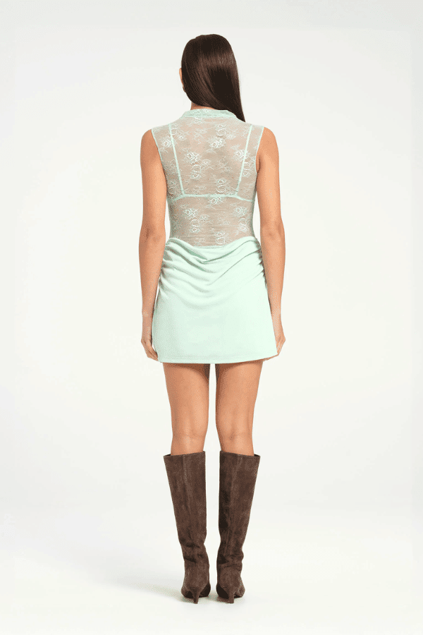 Benni Darby Mini Dress in Bleached Aqua, a lace mini with a high neckline, detachable bralette, and draped jersey skirt for feminine elegance.