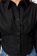 Darcy Shirt in Black by Mossman, a structured cropped cotton shirt with shoulder pads and exposed button front.
